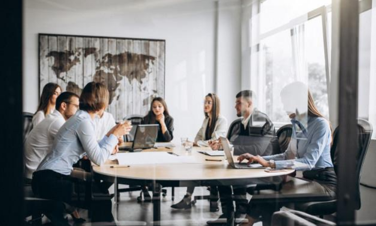 Office Professionals discussing how to implement effective Product Feedback Loop