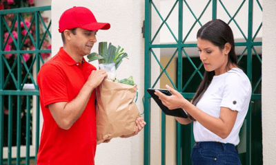 Delivery professional collecting feedback from the customer with Salesforce offline survey