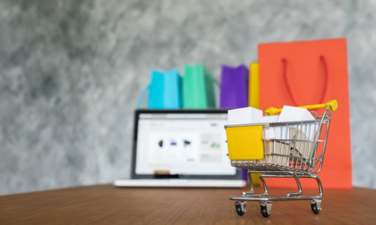 Laptop with Retail Survey Questions behind a retail cart