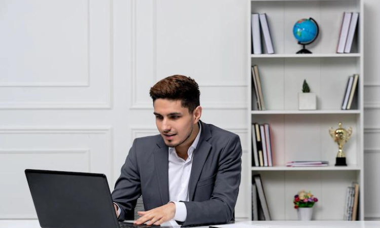 Businessman with laptop analyzing SaaS Feedback